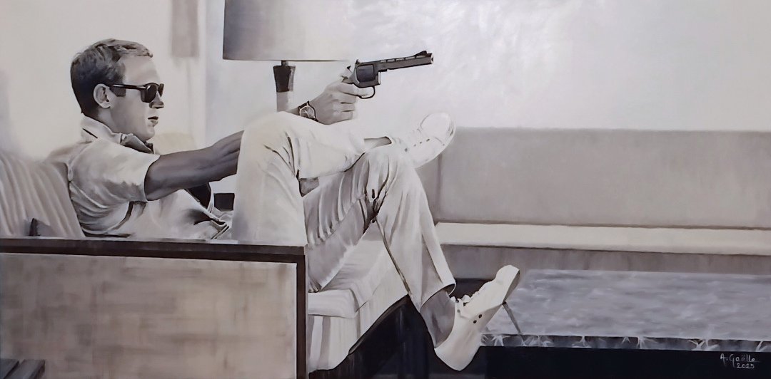 Steeve McQueen holding gun